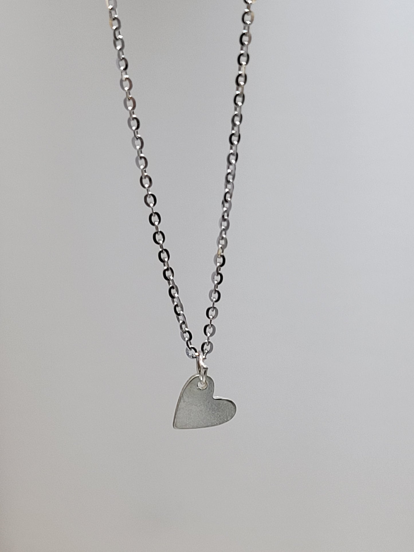 Silver necklace charm