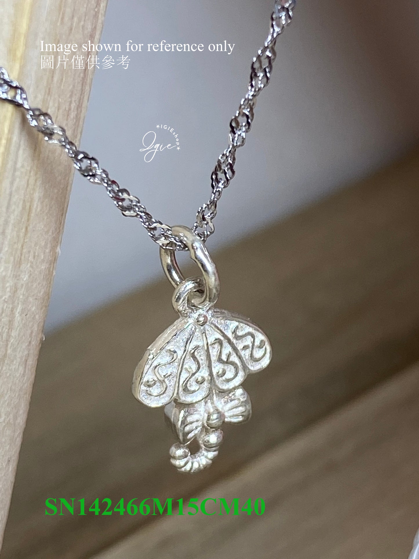 Silver necklace charm