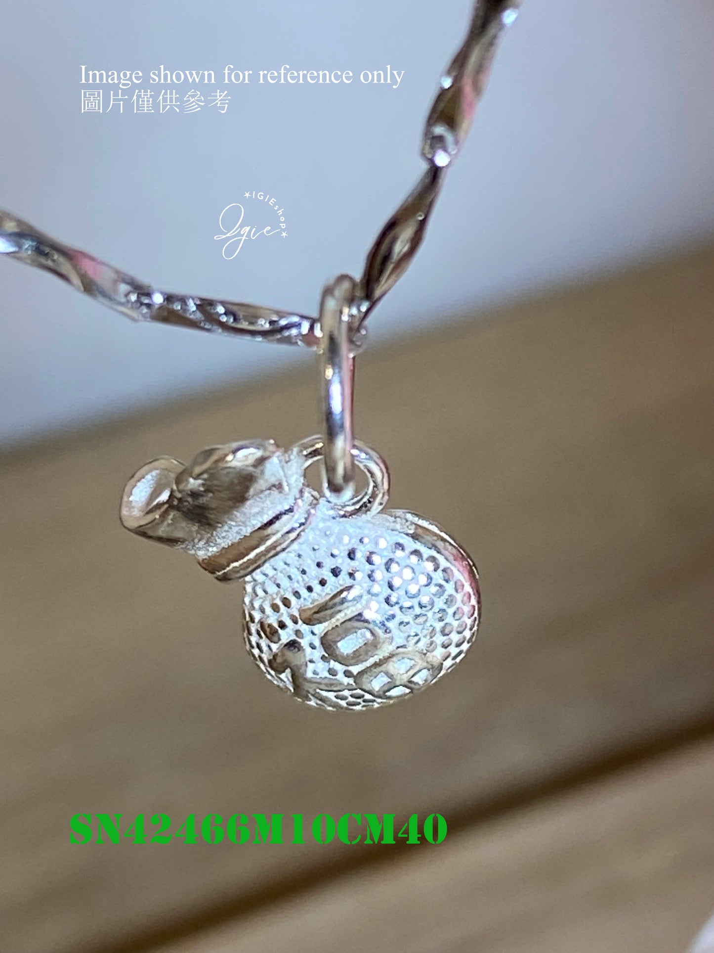 Silver necklace charm
