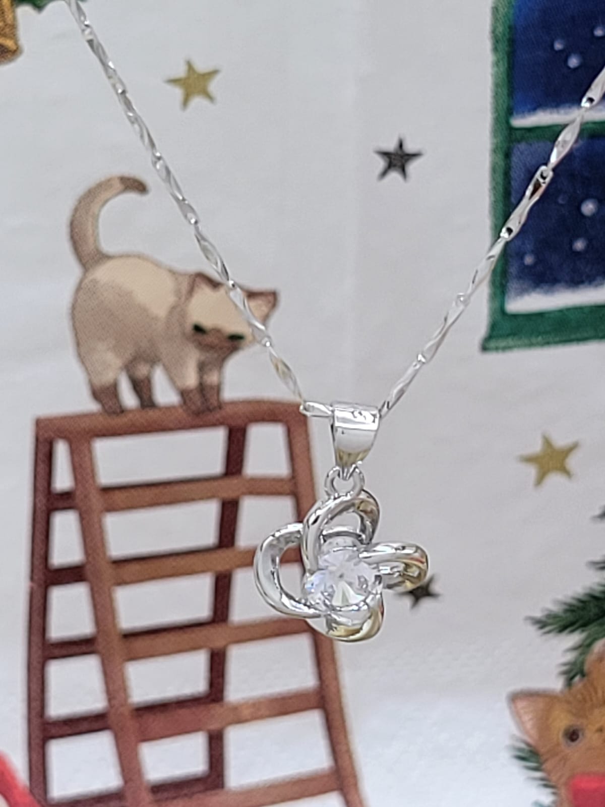 Silver necklace charm
